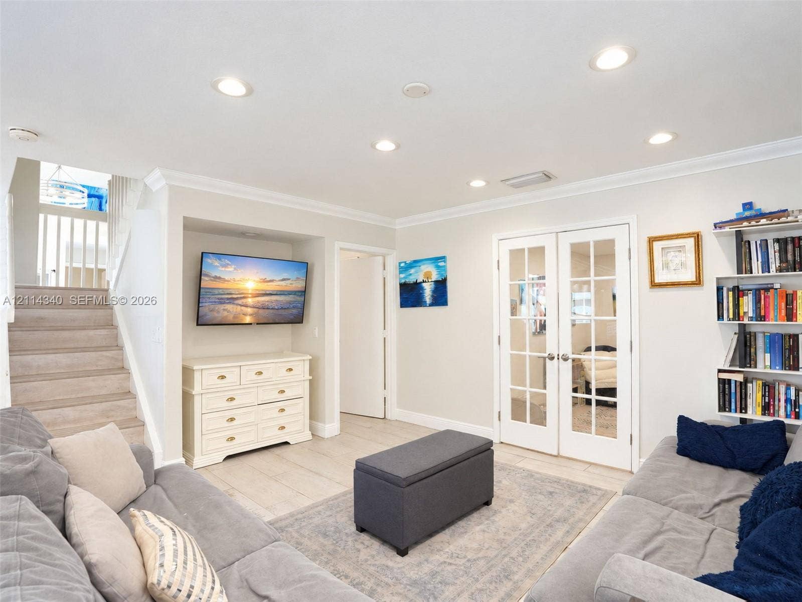 3586 SW 50th Street, Hollywood, FL 33312 Living area featuring recessed lighting, crown molding, tile flooring, built-in shelving, and double French doors with glass panes