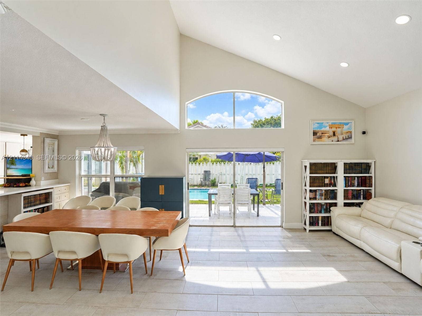 3586 SW 50th Street, Hollywood, FL 33312 Vaulted ceilings, arched transom window, recessed lighting, tile flooring, and glass sliding doors