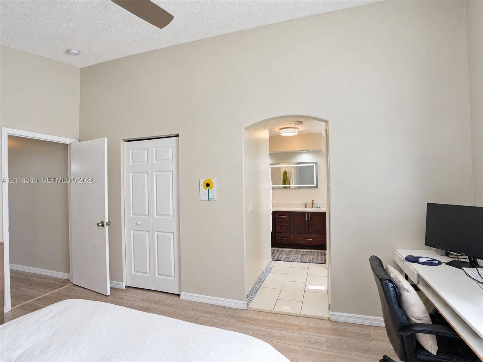 3586 SW 50th Street, Hollywood, FL 33312 High ceilings, arched doorway, wood-finish flooring, and white interior doors