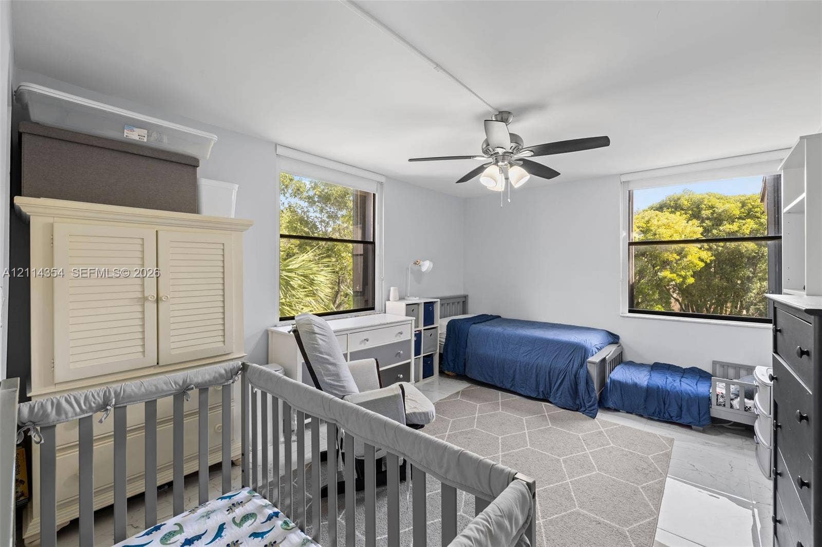 14401 SW 88th Street, #410N, Miami, FL 33186 Room with dual-pane windows, neutral wall coloring, and a central ceiling fan with integrated lighting