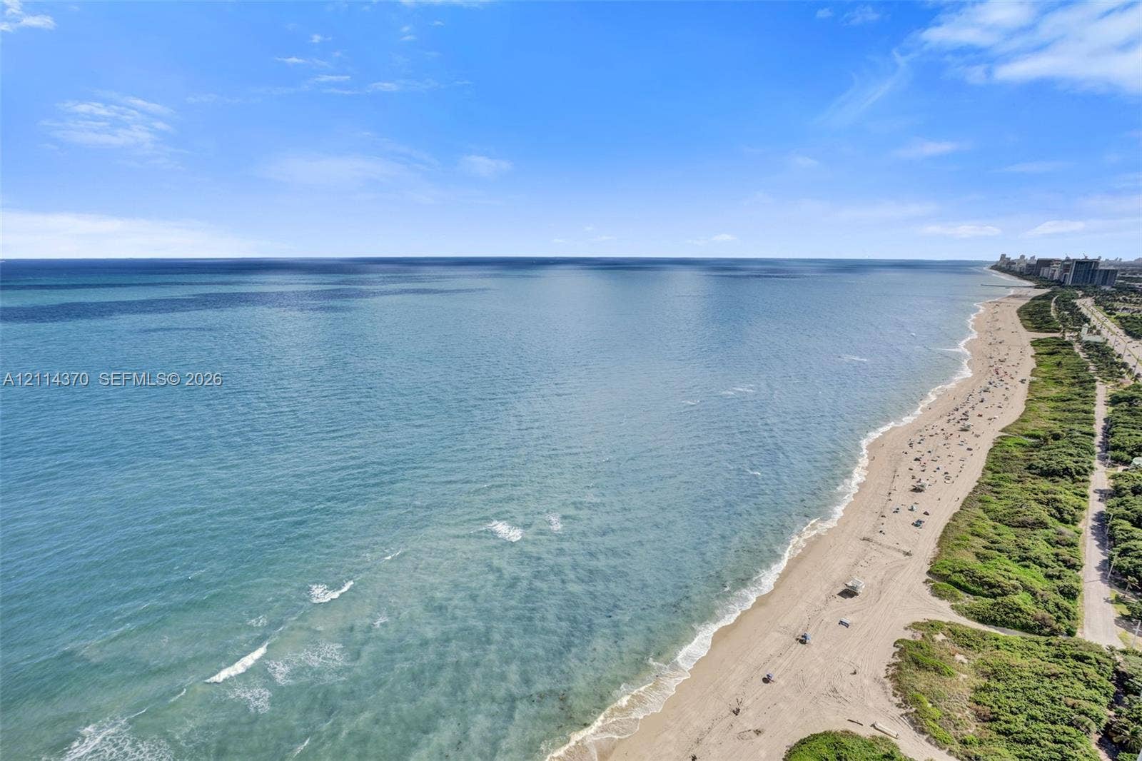 Sunny Isles Beach, Sunny Isles Beach, FL 33160 Aerial perspective showcasing an expansive shoreline, sandy beach, and proximity to coastal vegetation