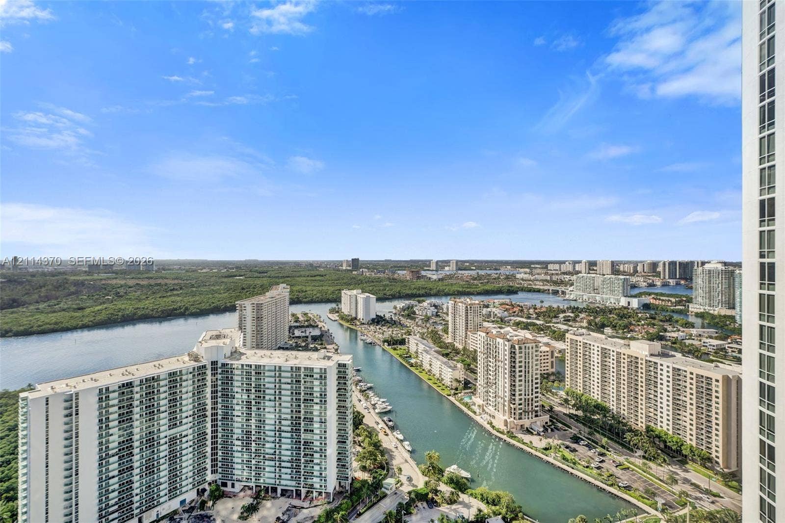 Sunny Isles Beach, Sunny Isles Beach, FL 33160 High-rise perspective featuring expansive water frontage, coastal surroundings, and panoramic skyline vistas