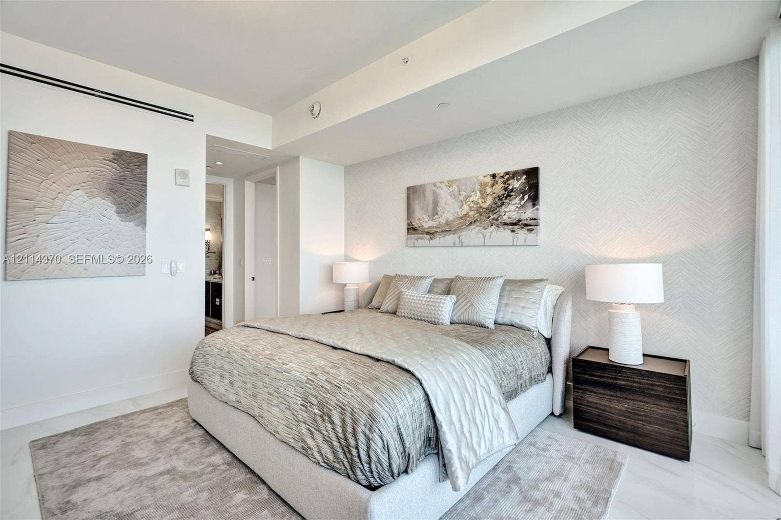 Sunny Isles Beach, Sunny Isles Beach, FL 33160 High ceilings with recessed lighting, light-toned stone-finish flooring, and textured accent wall covering