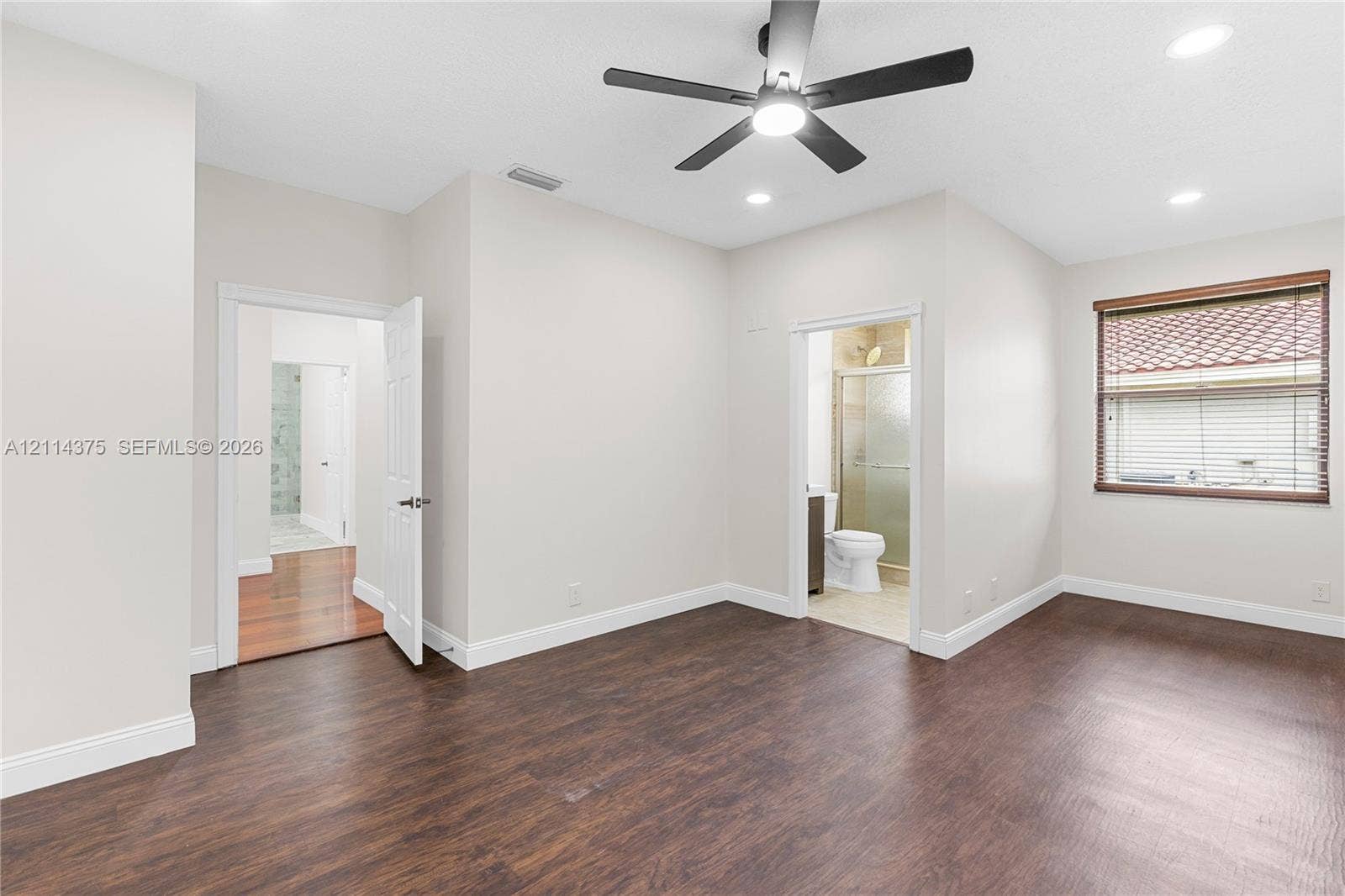 1206 S Manor Drive S, Weston, Weston, FL 33326 Interior space featuring wood-finish flooring, a multi-blade ceiling fan with integrated lighting, recessed lighting, and a window with horizontal blinds