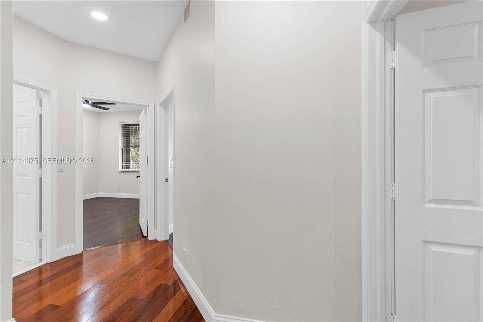 1206 S Manor Drive S, Weston, Weston, FL 33326 Interior hallway featuring wood-finish flooring, recessed lighting, and multi-panel interior doors