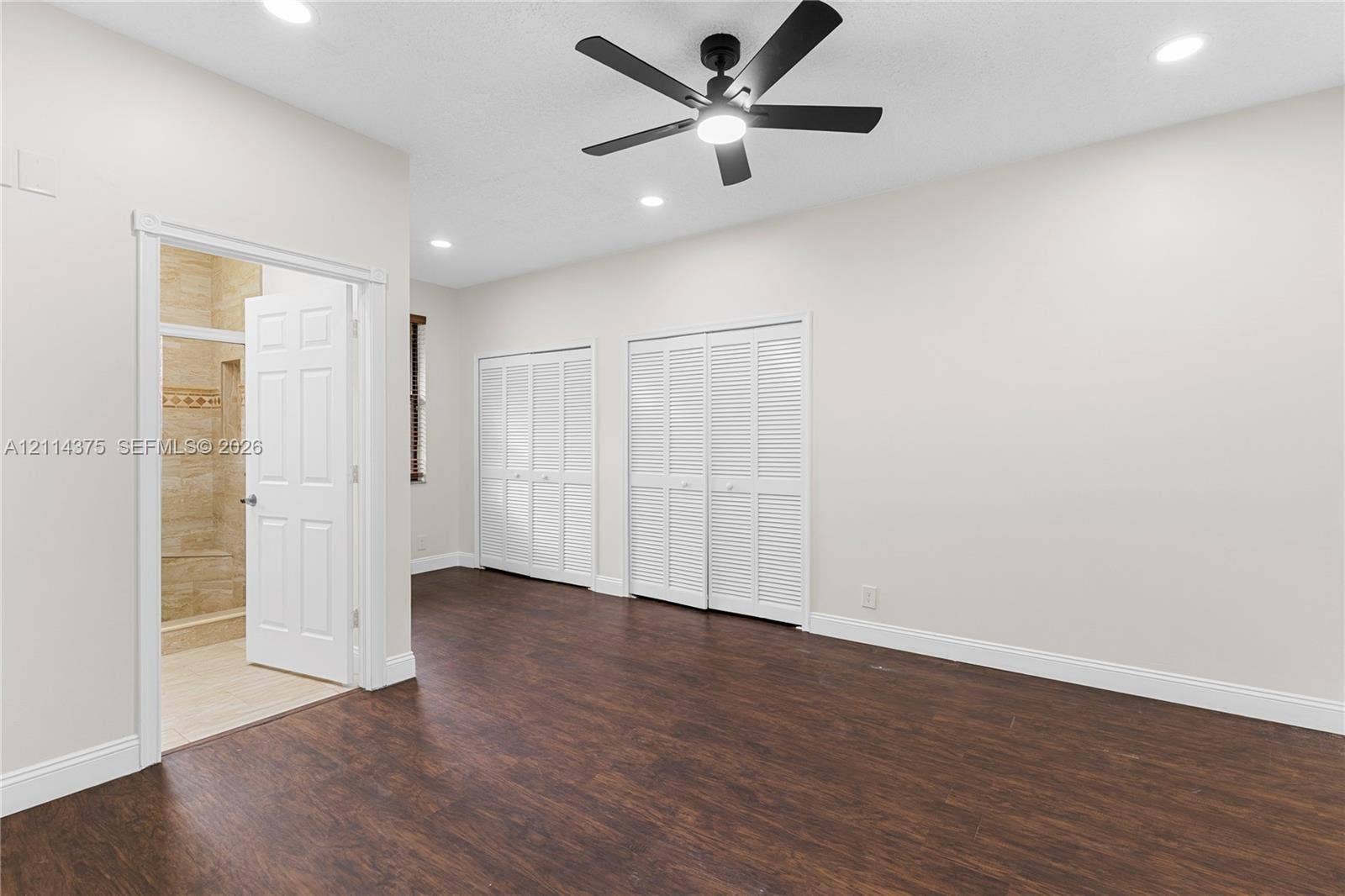 1206 S Manor Drive S, Weston, Weston, FL 33326 Wood-finish flooring, recessed lighting, ceiling fan with integrated light, and two sets of louvered-style closet doors