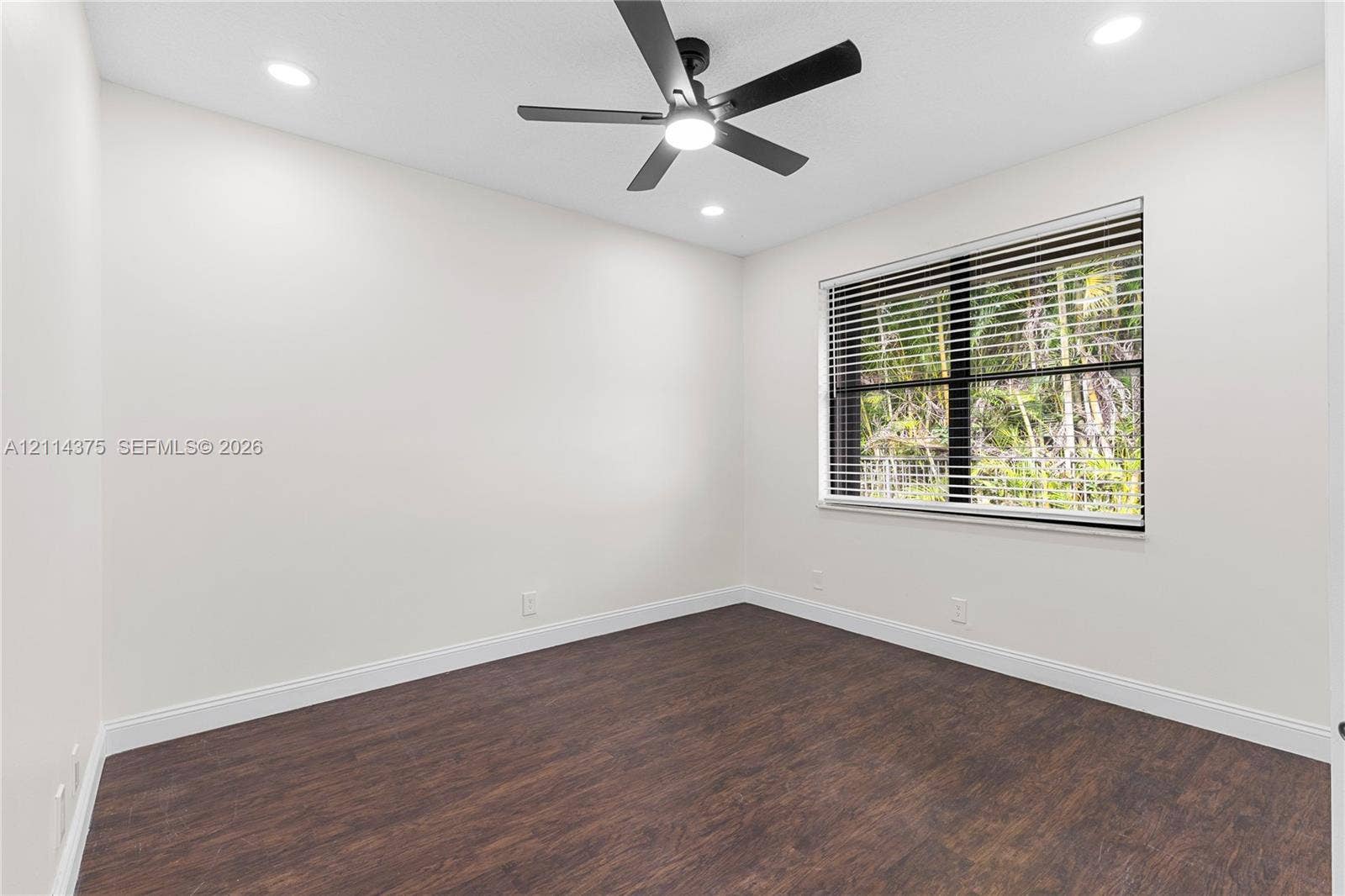 1206 S Manor Drive S, Weston, Weston, FL 33326 Room featuring wood-finish flooring, recessed lighting, and a multi-blade ceiling fan with integrated lighting