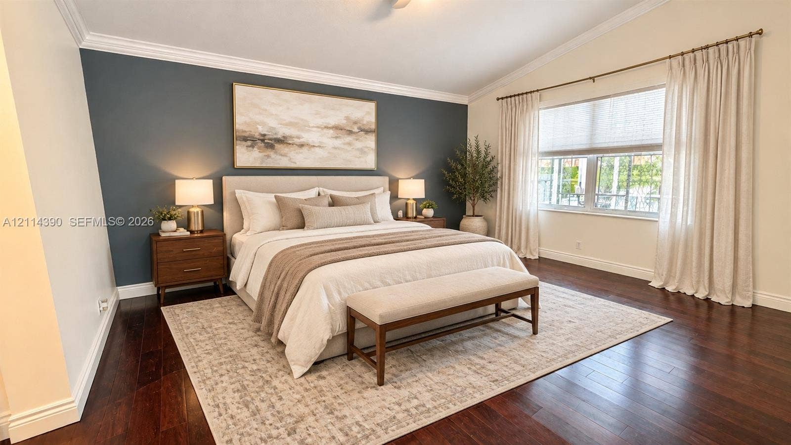 21196 Via Ventura, Boca Raton, FL 33433 Vaulted ceiling with crown molding, dark wood-finish flooring, and large window with multi-panel casing