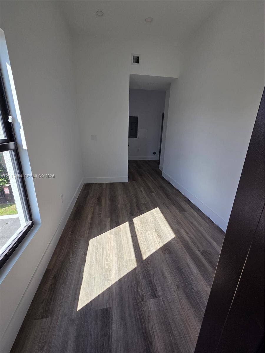 401 Pembroke Road, #203, Hallandale Beach, Hallandale Beach, FL 33009 Interior room featuring wood-finish flooring, recessed lighting, and a large window