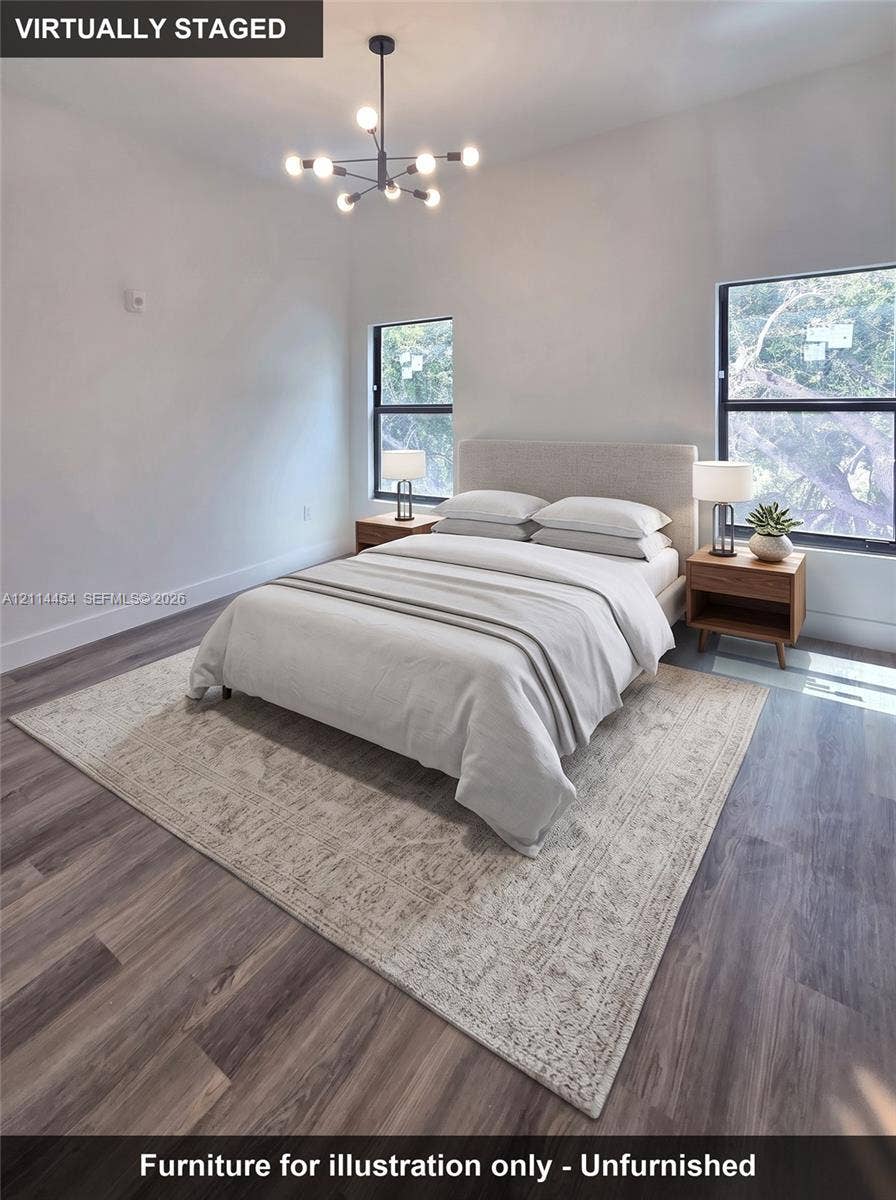 401 Pembroke Road, #203, Hallandale Beach, Hallandale Beach, FL 33009 Wood-finish flooring, multi-arm geometric light fixture, and dual windows with black frames