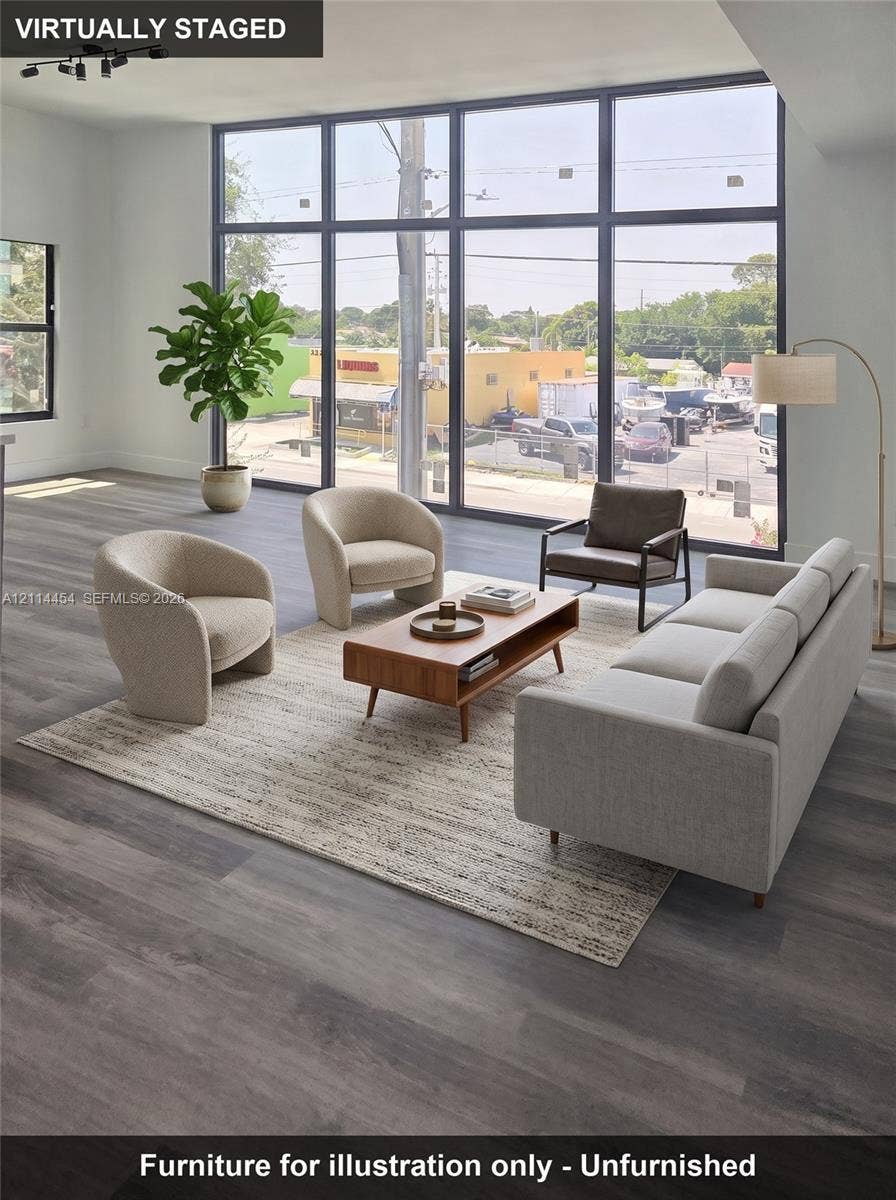 401 Pembroke Road, #203, Hallandale Beach, Hallandale Beach, FL 33009 Floor-to-ceiling windows with black framing, wood-finish flooring, and recessed ceiling lighting