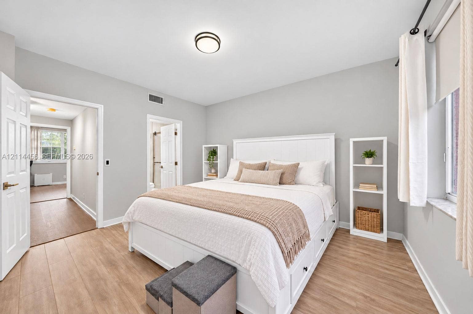Neutral paint finish, wood-finish flooring, and flush-mount ceiling lighting