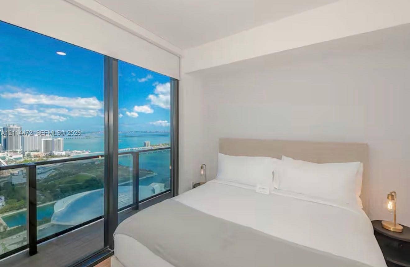 398 NE 5th Street, #4001, Miami, FL 33132 Floor-to-ceiling windows, access to a private balcony, metal railing system, and recessed ceiling lighting