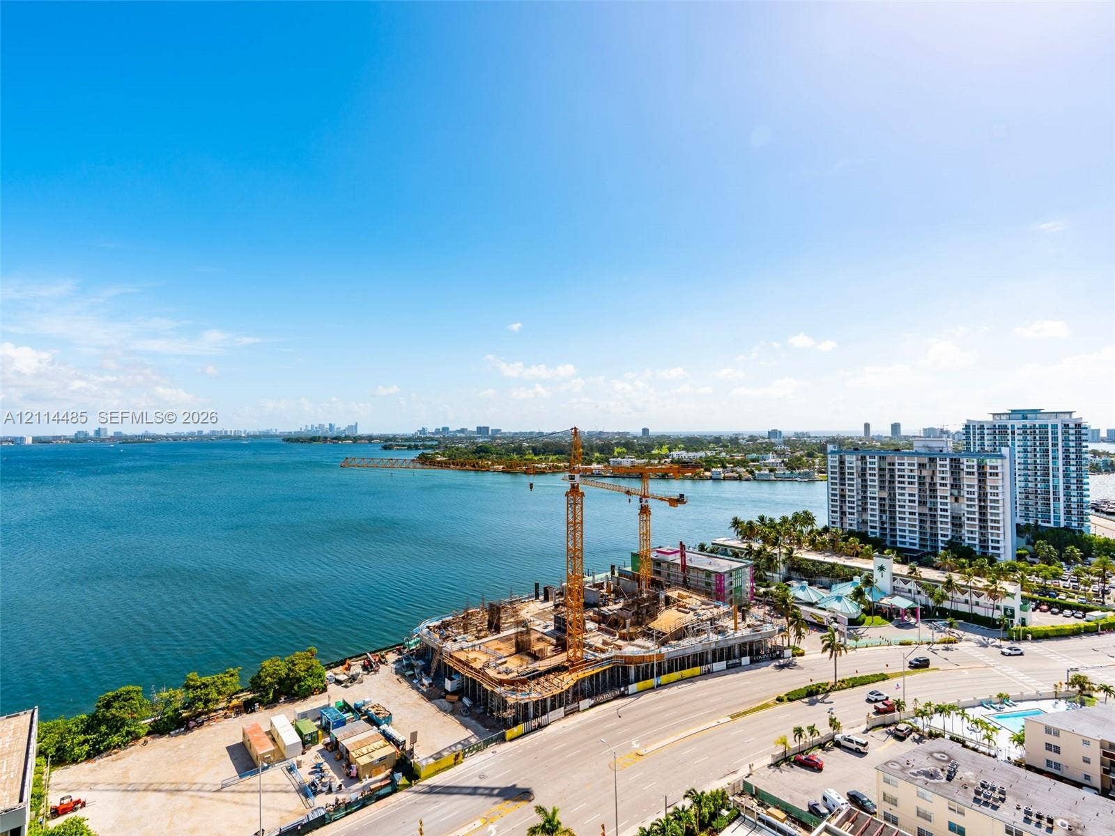 Panoramic waterfront perspective featuring an expansive bay coastline and established high-rise infrastructure