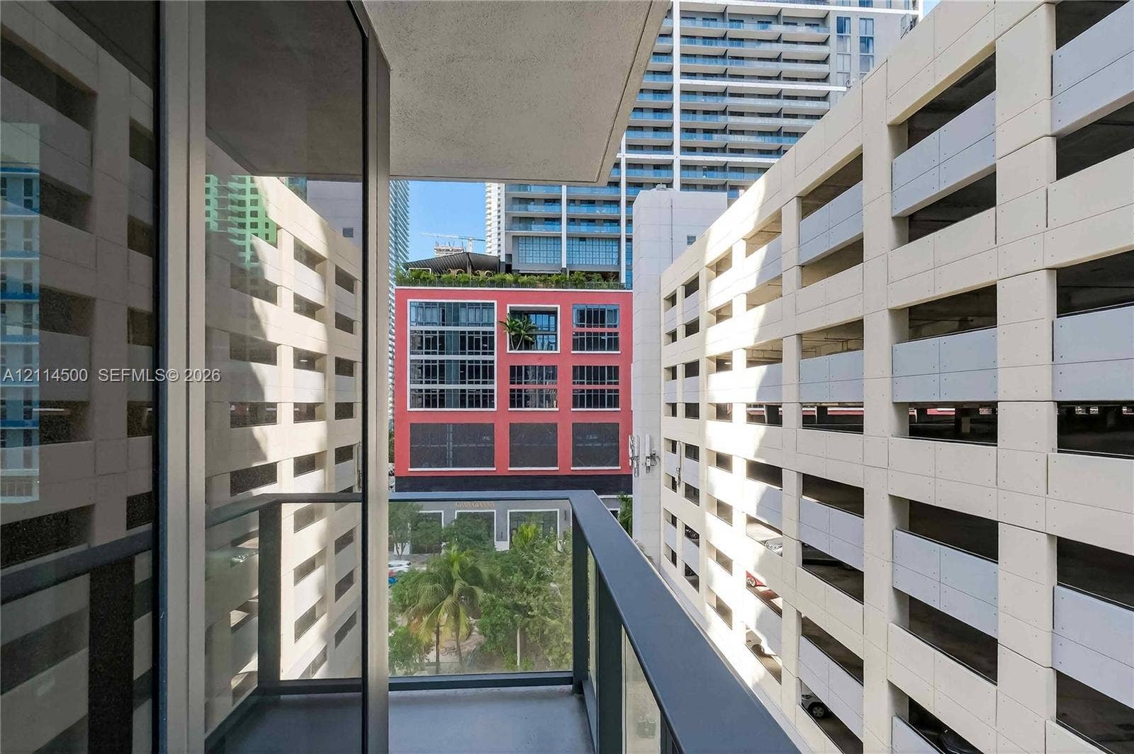 121 NE 5th Street, #712B, Miami, FL 33132 Private balcony featuring glass panel railings and metal framing