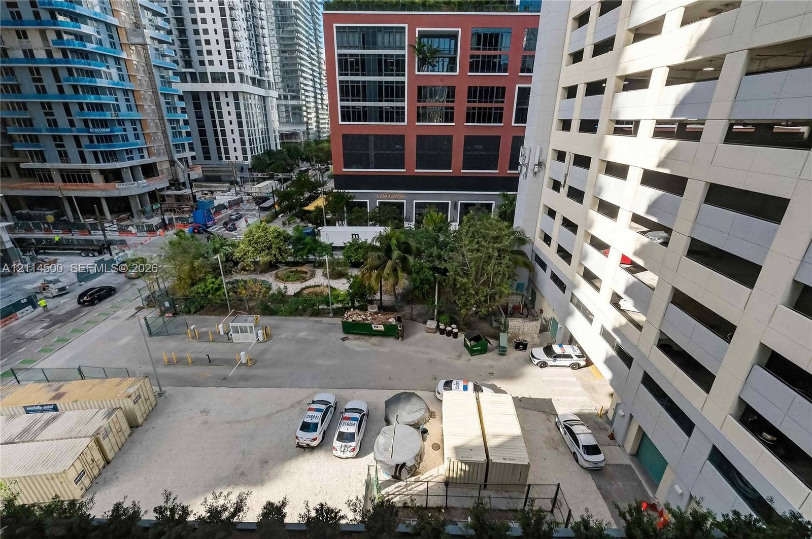 121 NE 5th Street, #712B, Miami, FL 33132 Urban outdoor space featuring mature palm trees and landscaped green areas