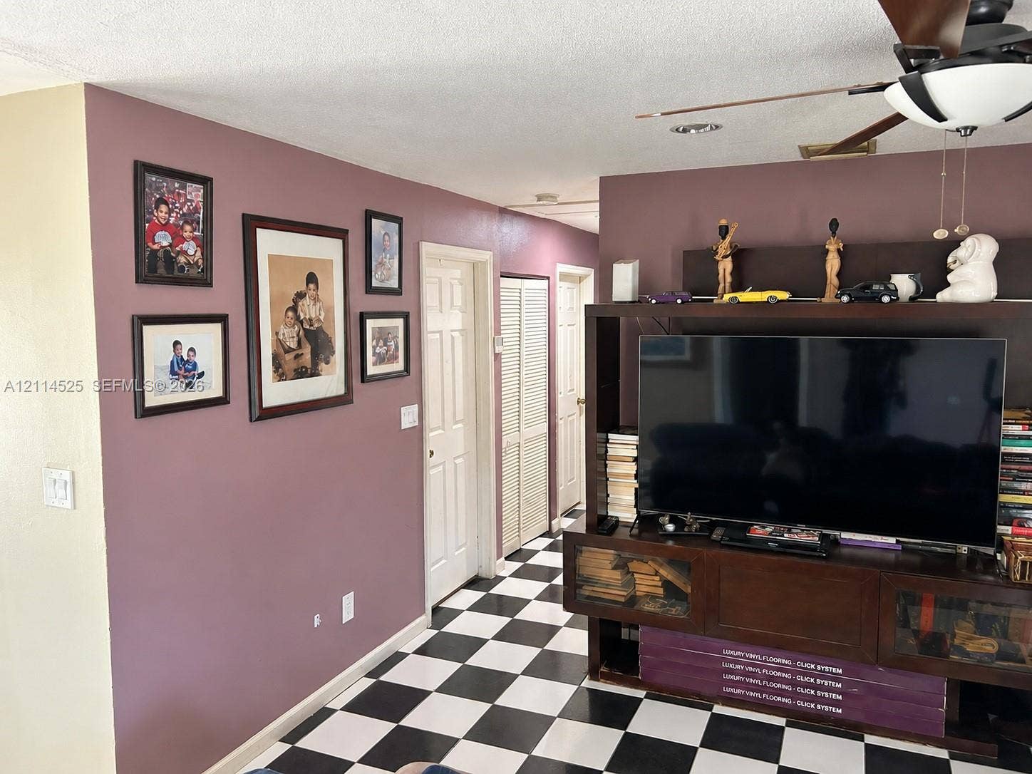 18905 SW 313th Terrace, Homestead, FL 33030 Checkered tile flooring, ceiling fan with integrated lighting, and interior six-panel doors