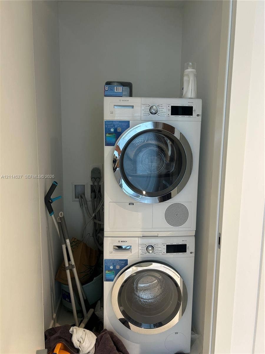 Stackable white Bosch front-load washer and dryer unit