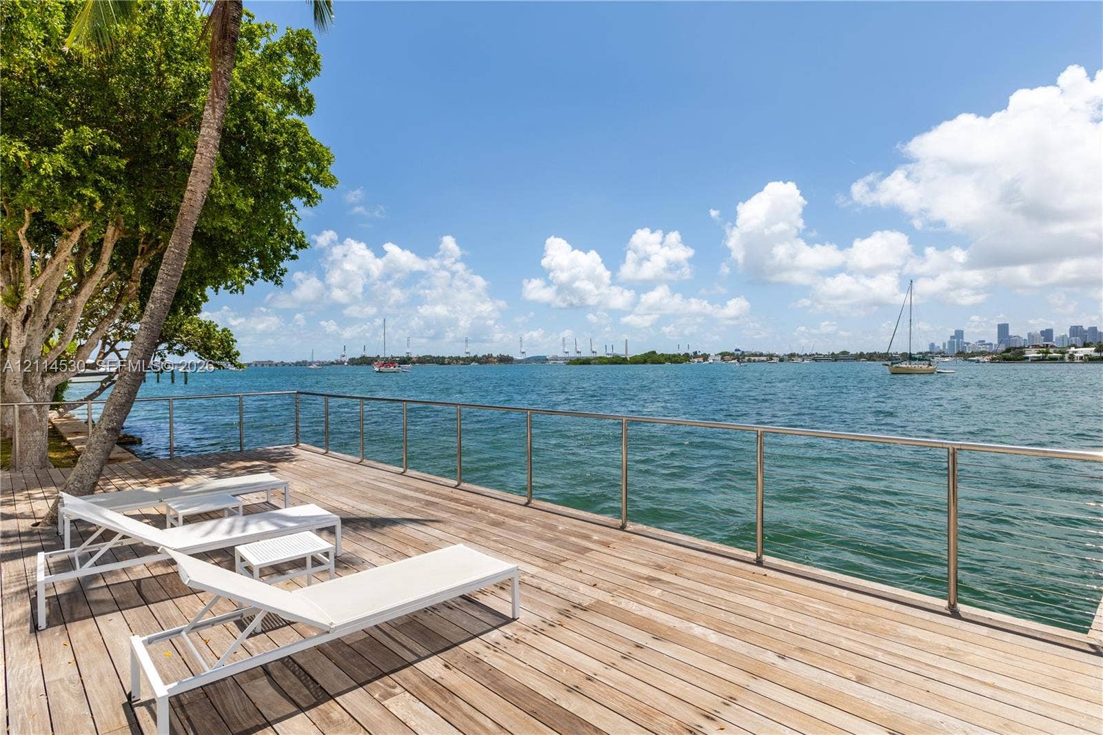 3 Island Avenue, #14L, Miami Beach, FL 33139 Waterfront wood deck featuring stainless steel railings and mature trees