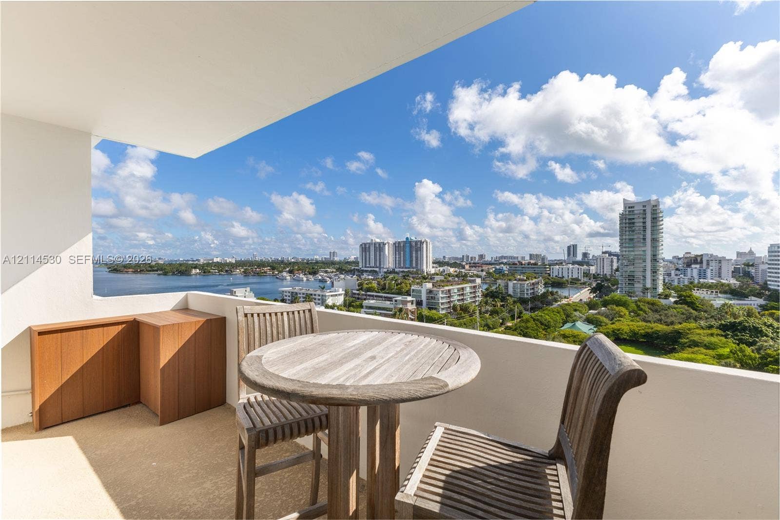 3 Island Avenue, #14L, Miami Beach, FL 33139 Private balcony with solid half-wall enclosure and built-in wood cabinetry