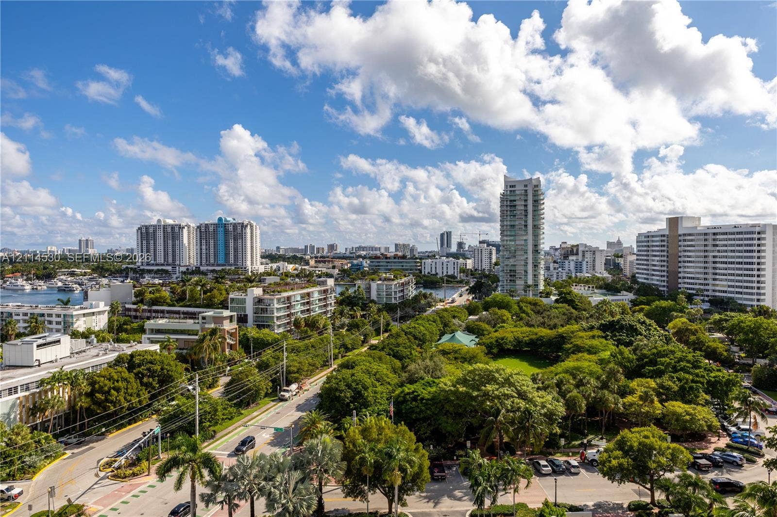3 Island Avenue, #14L, Miami Beach, FL 33139 Panoramic cityscape featuring dense tree canopy, waterfront boat slips, and multiple high-rise buildings