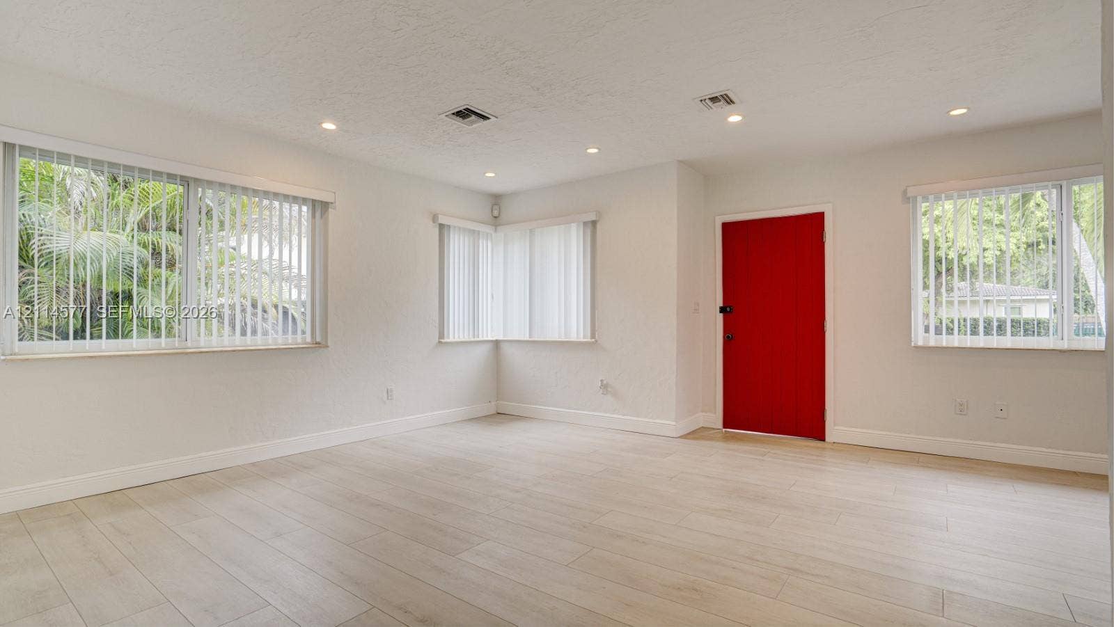 311 SW 38th Court, #0, Miami, Miami, FL 33134 Neutral walls paired with light-toned wood-finish flooring, recessed lighting, and vertical window blinds