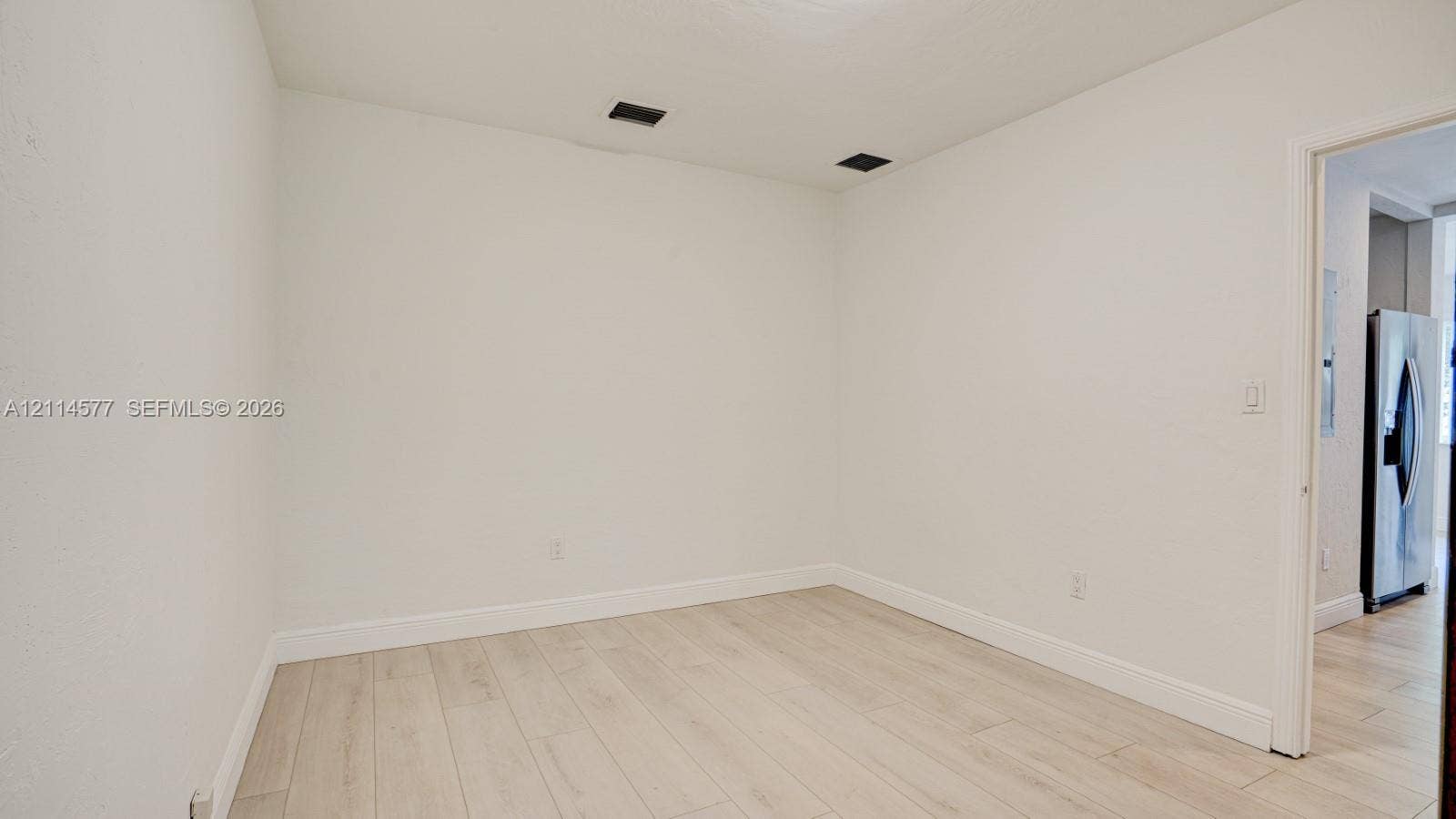 311 SW 38th Court, #0, Miami, Miami, FL 33134 Interior space featuring wood-finish tile flooring and neutral wall paint