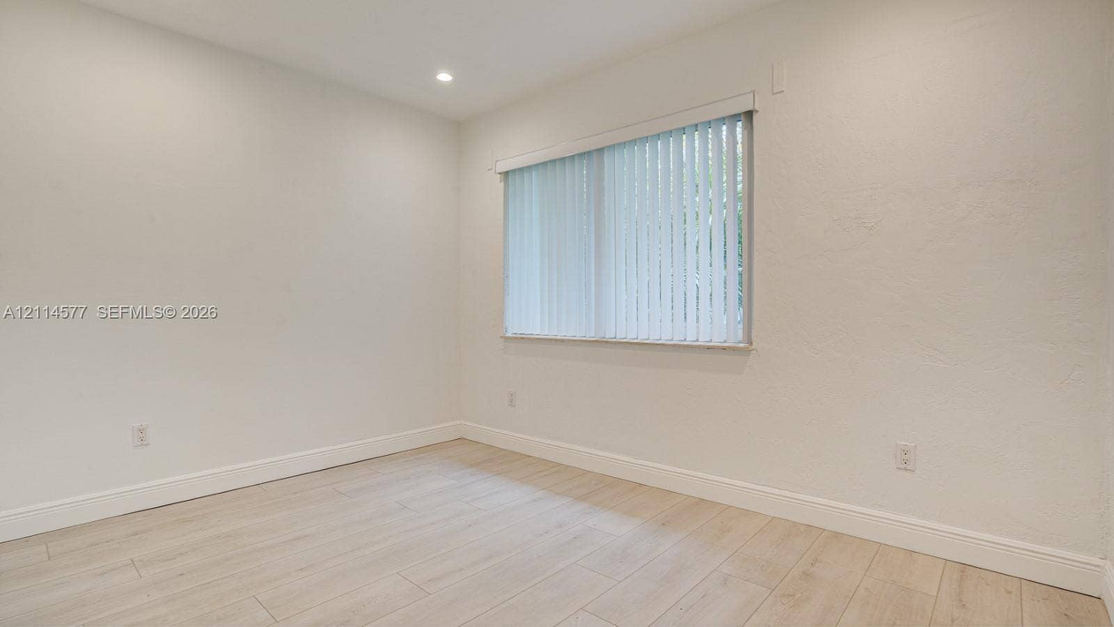 311 SW 38th Court, #0, Miami, Miami, FL 33134 Neutral-toned interior featuring wood-finish flooring, recessed lighting, and vertical window blinds