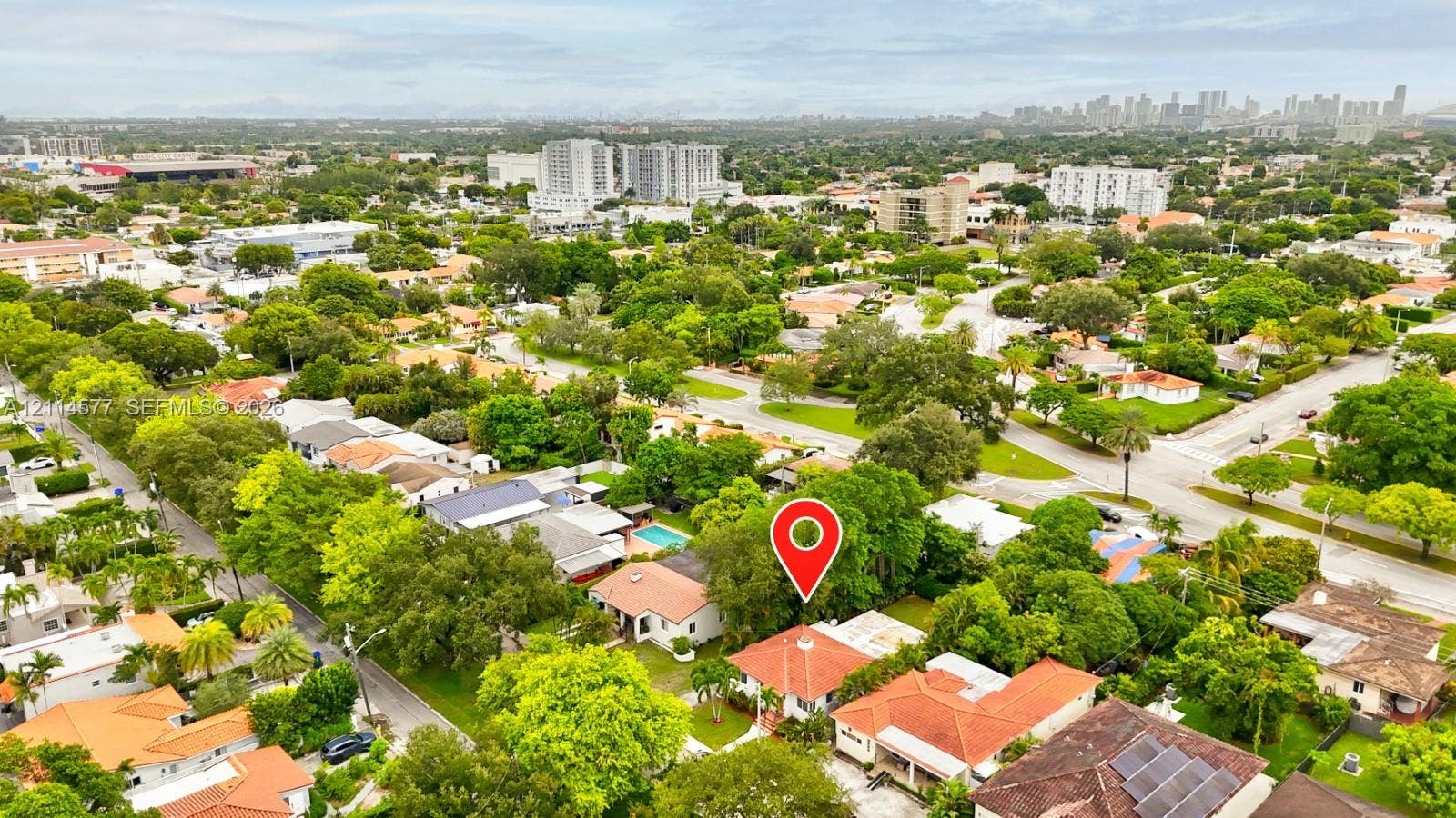 311 SW 38th Court, #0, Miami, Miami, FL 33134 Aerial view featuring a residential property with a multi-level tile roof, surrounding mature landscaping, and an established street grid