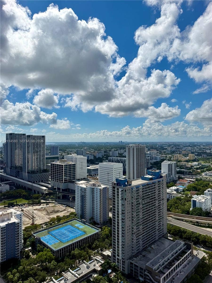 20 NE 11, #4109, Miami, FL 33132 Elevated urban outlook featuring a high-rise skyline, cityscape horizon, and a multi-court recreational facility