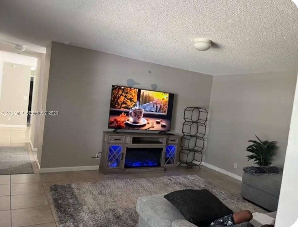12230 Dartmoor Drive, Wellington, FL 33414 Neutral-toned walls and neutral-colored tile flooring