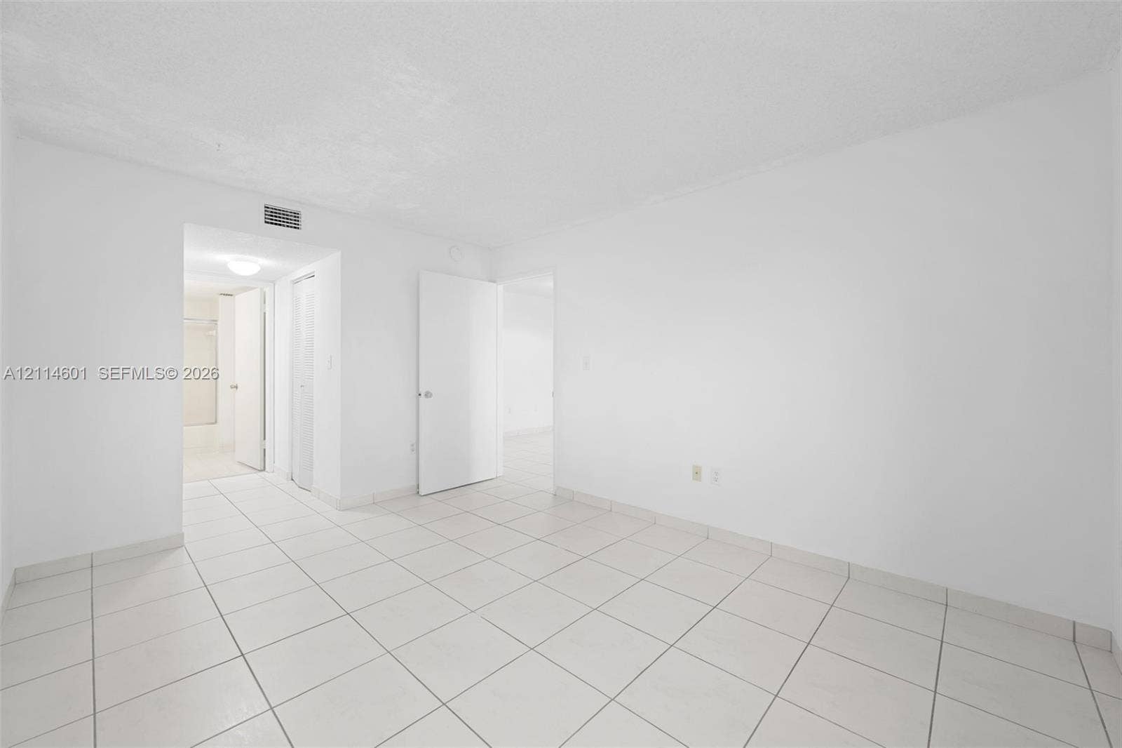 6801 Harding Avenue, #311, Miami Beach, Miami Beach, FL 33141 Interior space featuring large-format ceramic tile flooring, solid-core interior doors, and neutral wall finishes