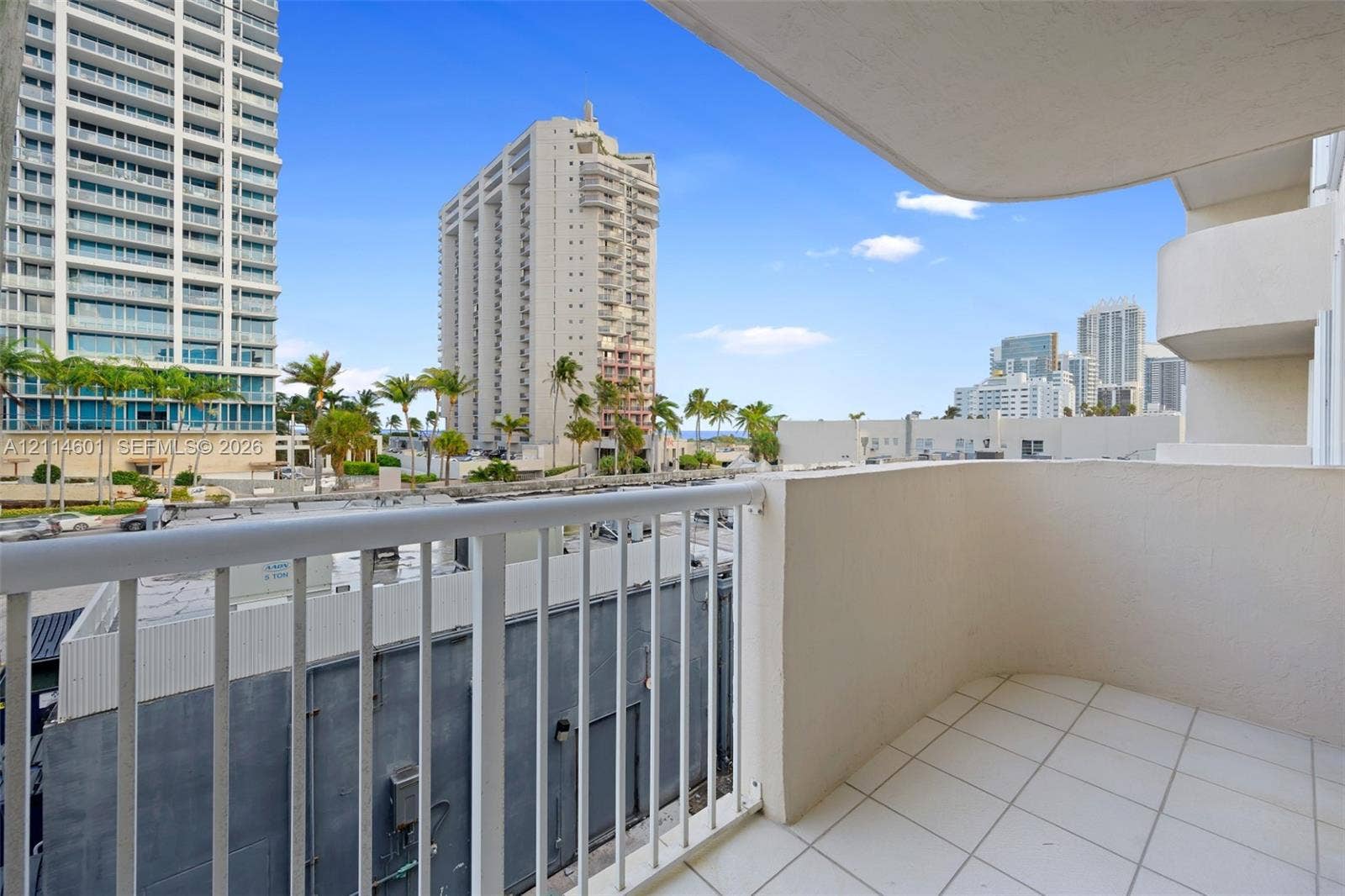 6801 Harding Avenue, #311, Miami Beach, Miami Beach, FL 33141 Covered balcony featuring white tiled flooring and a white metal railing