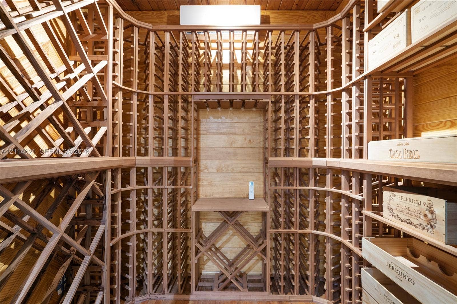 8978 NW 152nd Lane, #8978, Miami Lakes, Miami Lakes, FL 33018 Custom built-in wood wine racking with individual bottle storage, diamond-patterned bins, and a central display shelf