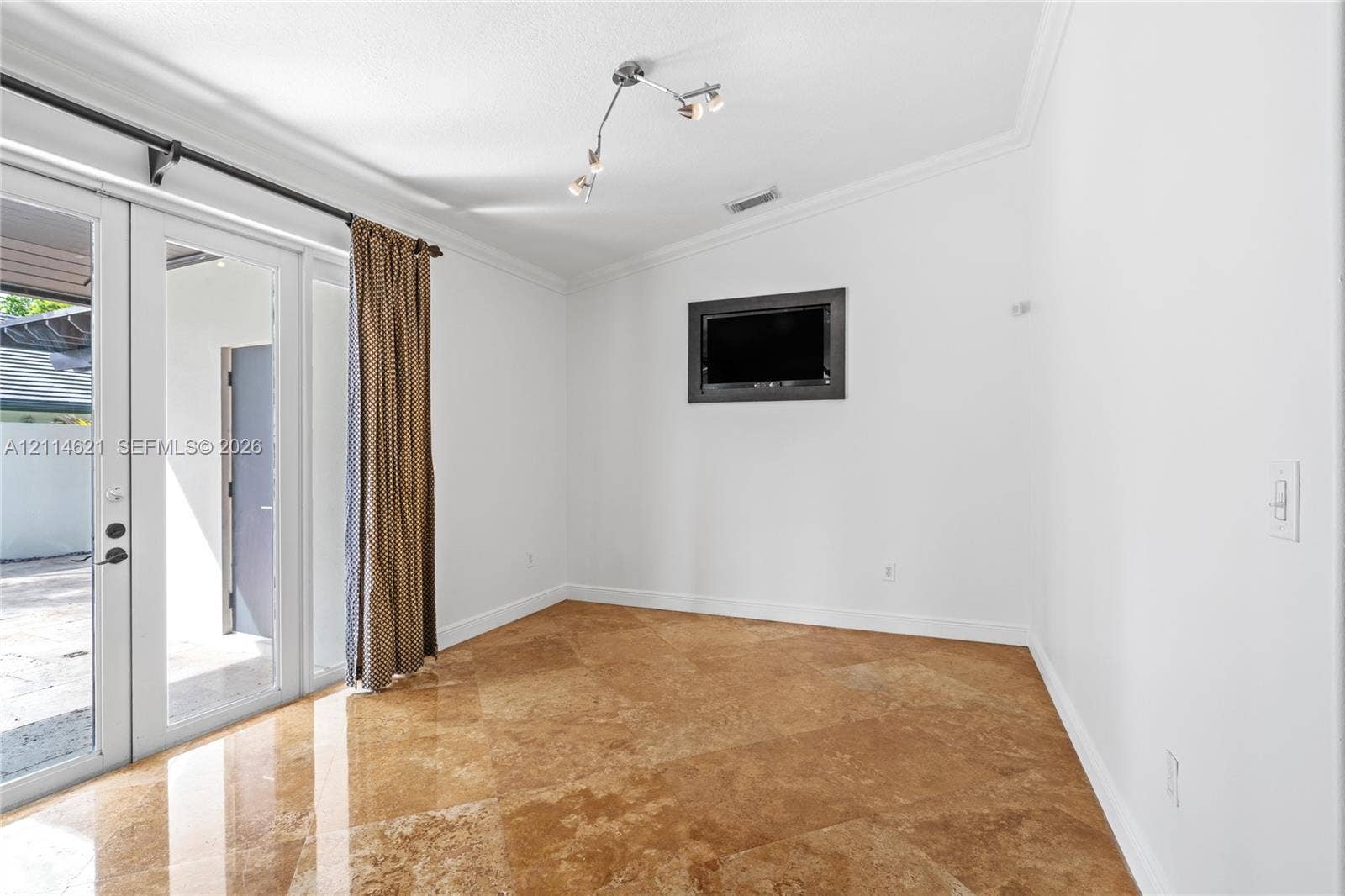8978 NW 152nd Lane, #8978, Miami Lakes, Miami Lakes, FL 33018 Polished stone flooring, crown molding, multi-light ceiling fixture, and glass-paned double doors