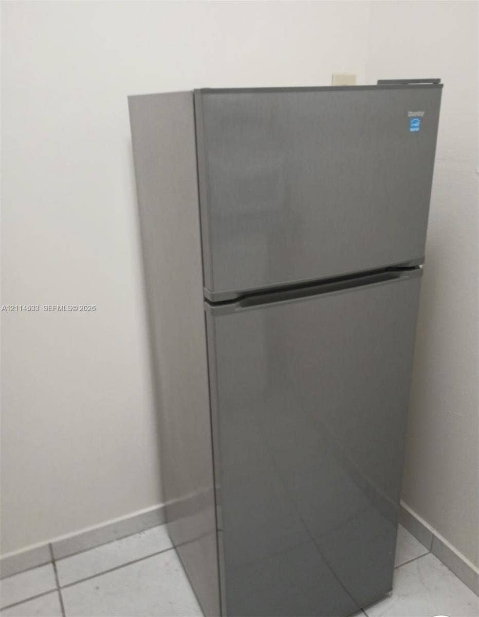 Top-mount refrigerator featuring a stainless-steel finish and Energy Star certification