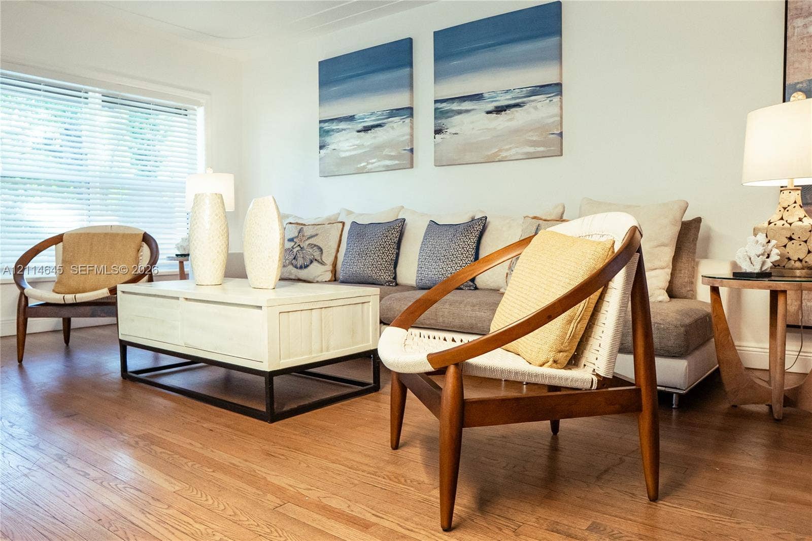 Wood-finish flooring and large multi-pane window with adjustable blinds