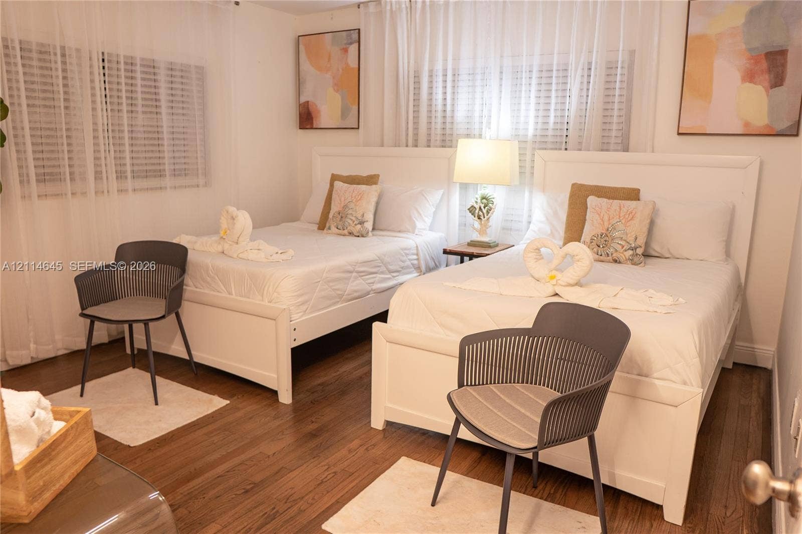 Wood-finish flooring and white horizontal blinds