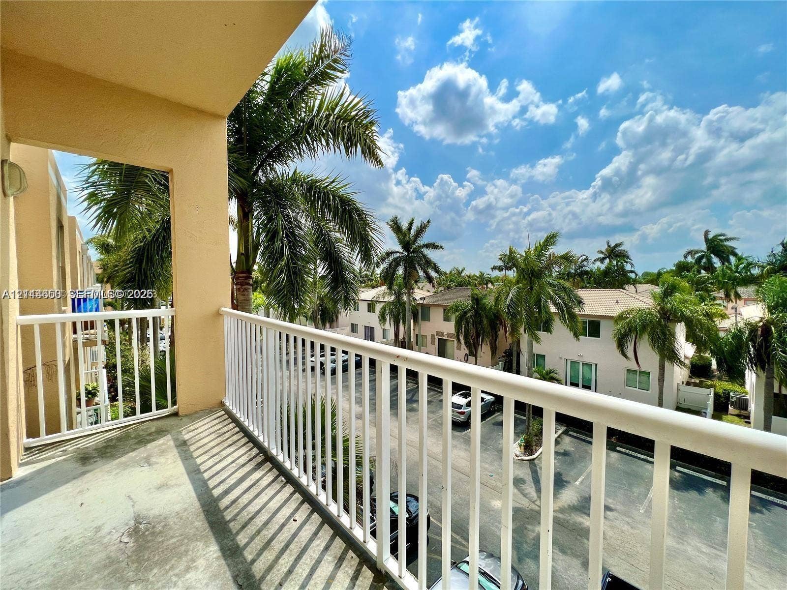 1450 SE 3rd Avenue, #411, Dania, Dania Beach, FL 33004 Covered balcony featuring concrete flooring and a white metal railing