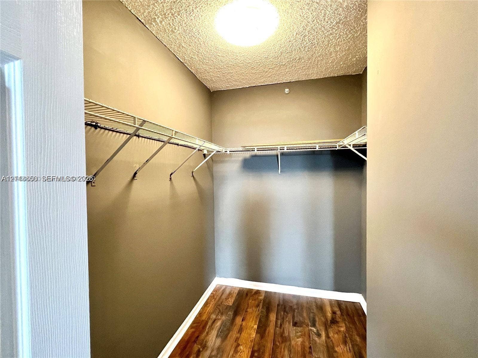 1450 SE 3rd Avenue, #411, Dania, Dania Beach, FL 33004 Storage space featuring wood-finish flooring and integrated wire shelving