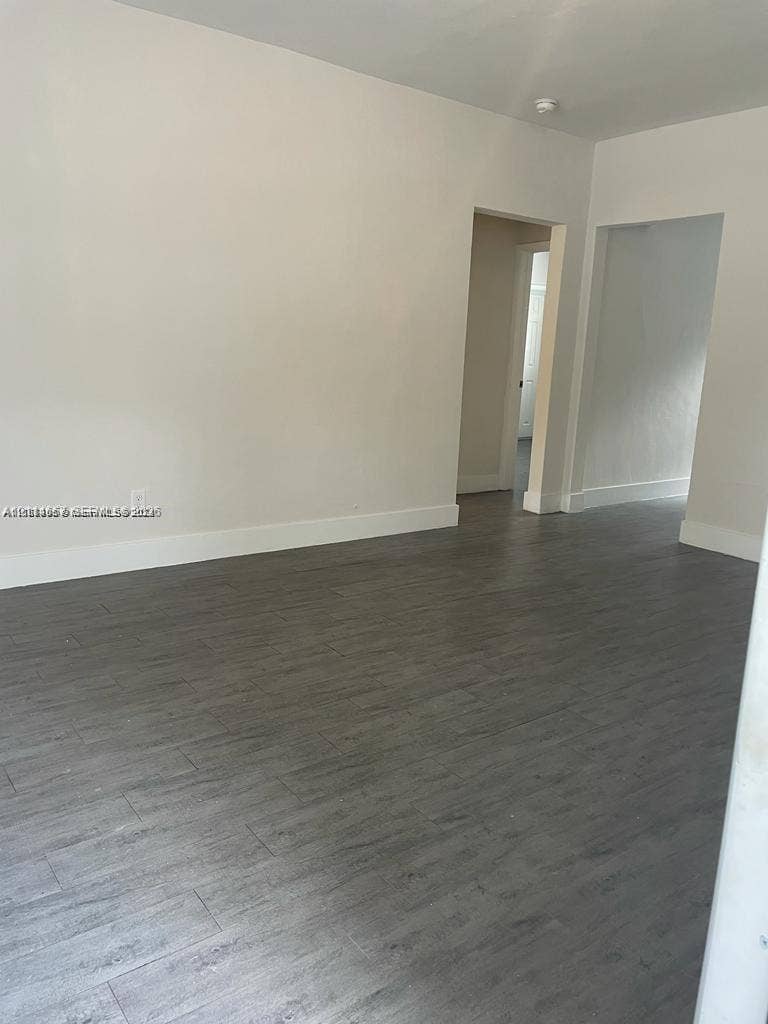 770 NE 123rd Street, #12, North Miami, North Miami, FL 33161 Neutral wall palette featuring wood-finish plank flooring and ceiling-mounted light fixture