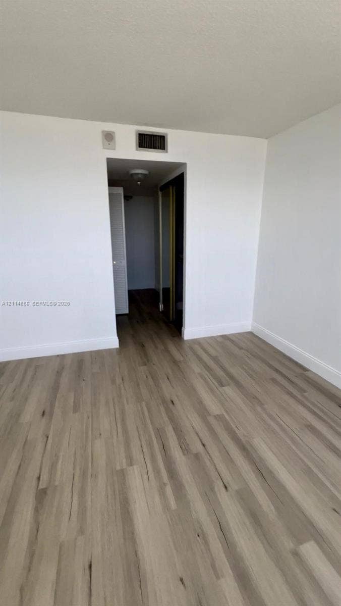 Wood-finish flooring and neutral-toned walls