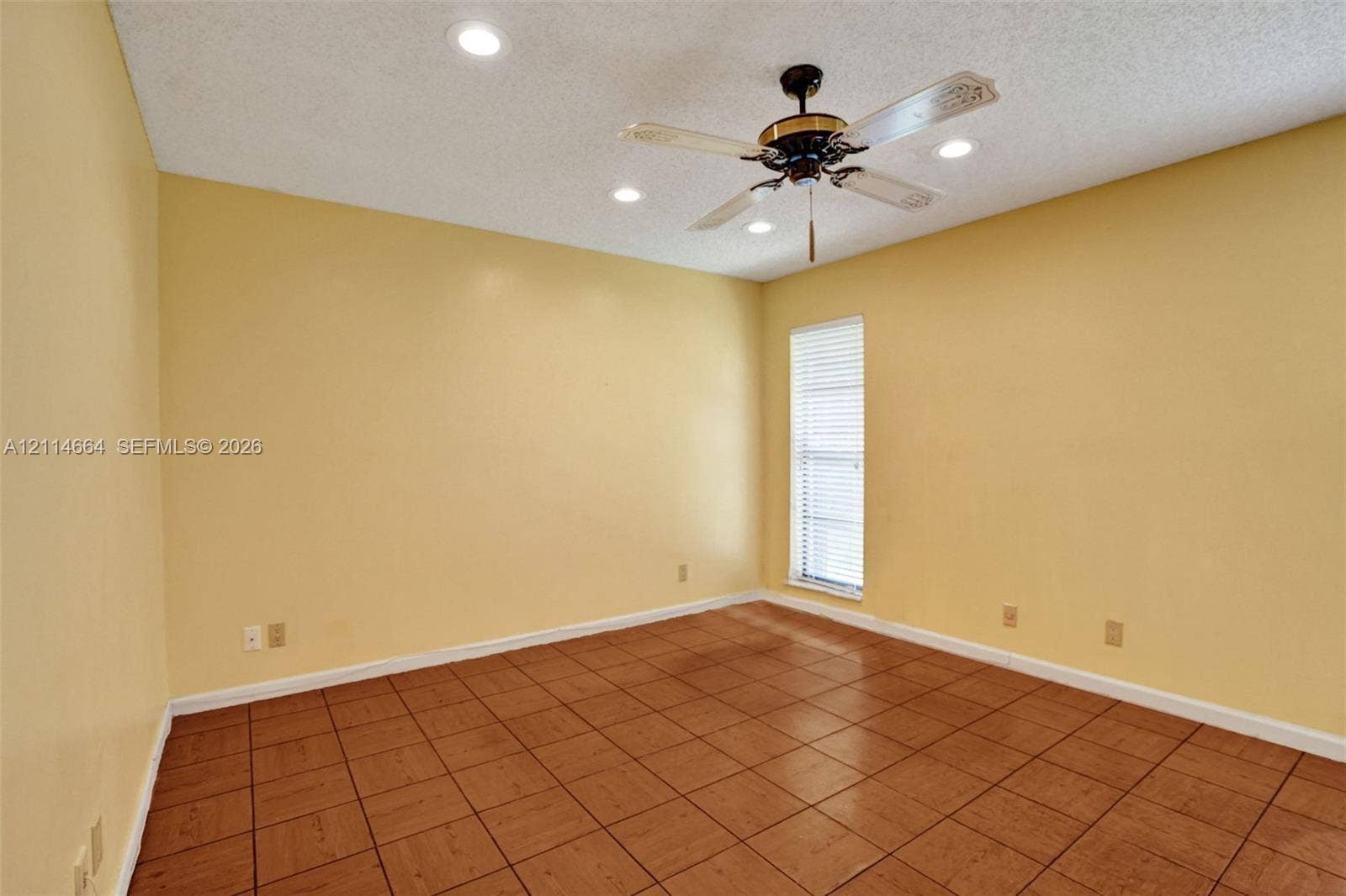 11164 NW 10th Place, Coral Springs, FL 33071 Ceramic tile flooring, ceiling fan with integrated light fixture, and recessed lighting