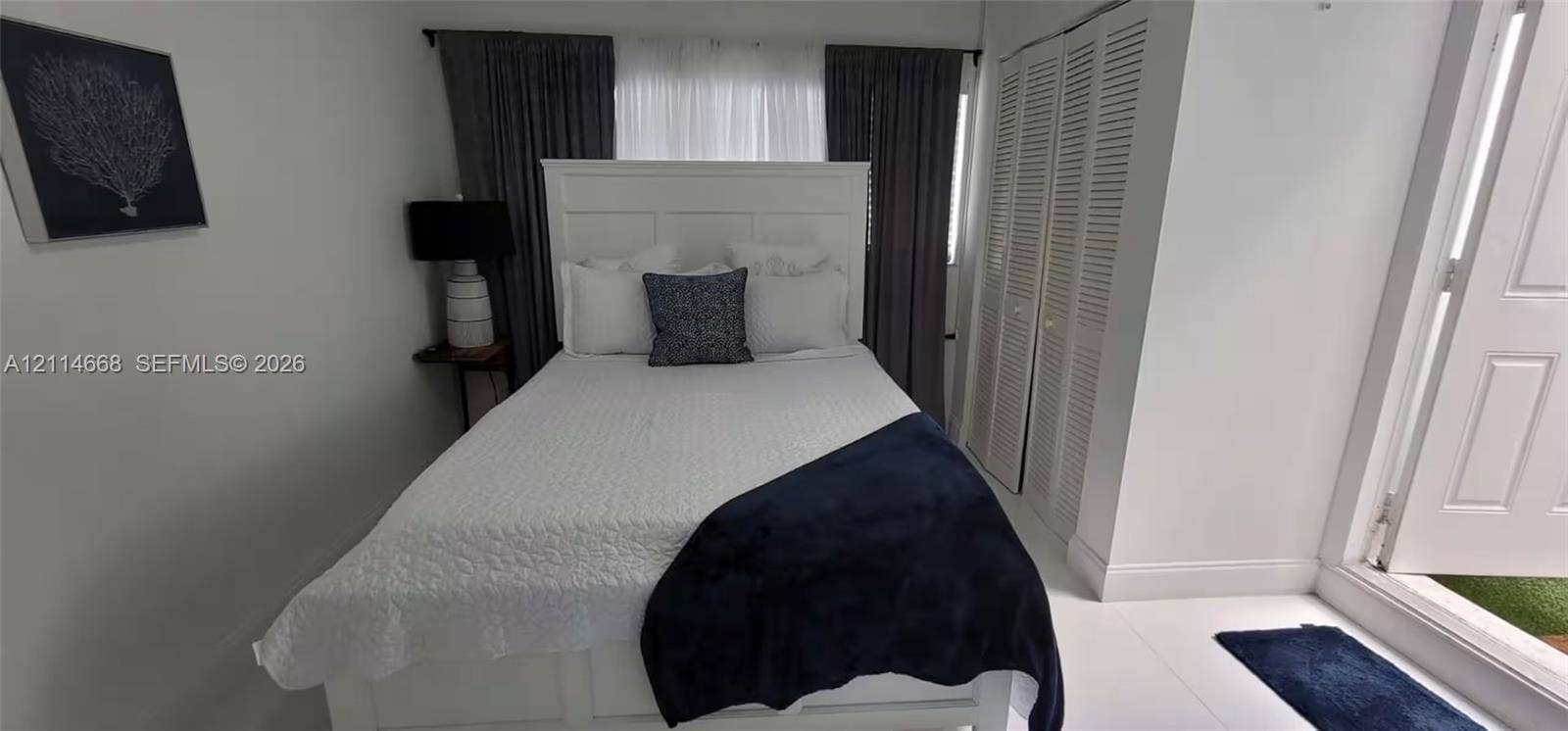 35 SW 28th Road, #B, Miami, Miami, FL 33129 Louvered bi-fold closet doors and neutral tile flooring