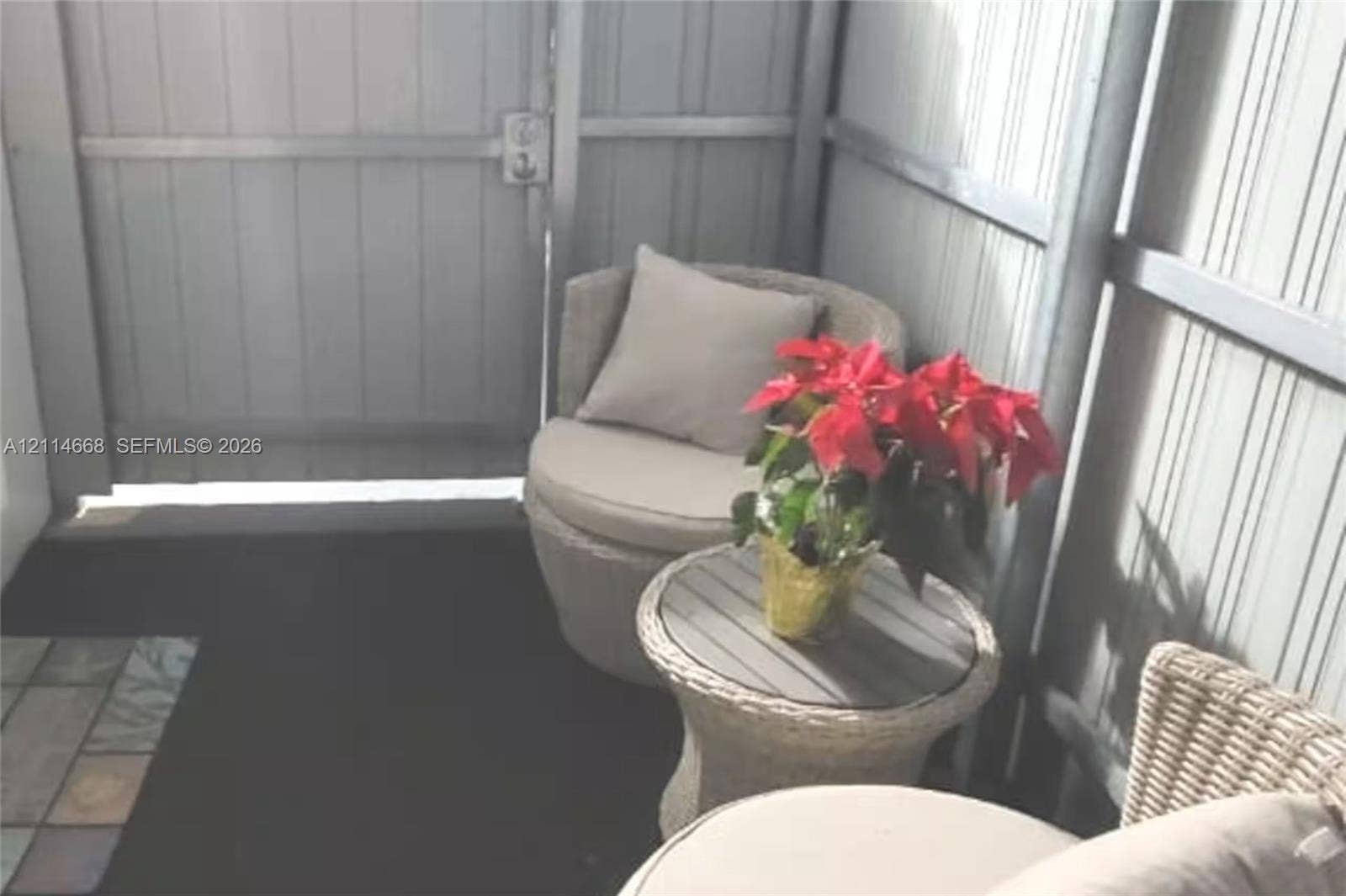 35 SW 28th Road, #B, Miami, Miami, FL 33129 Private outdoor space featuring vertical ribbed metal wall panels and a metal security gate