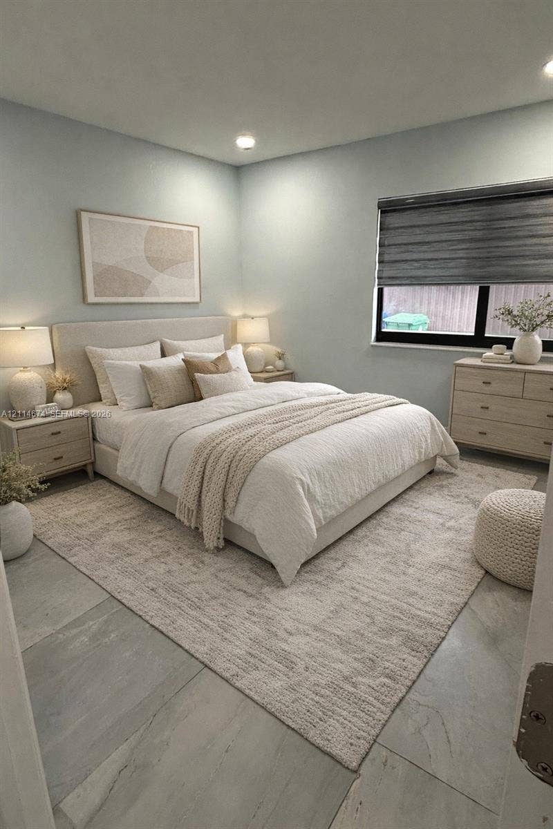 423 NW 32nd Place, Miami, Miami, FL 33125 Neutral-toned room featuring large-format tile flooring, recessed lighting, and a window with a dark-framed sliding sash