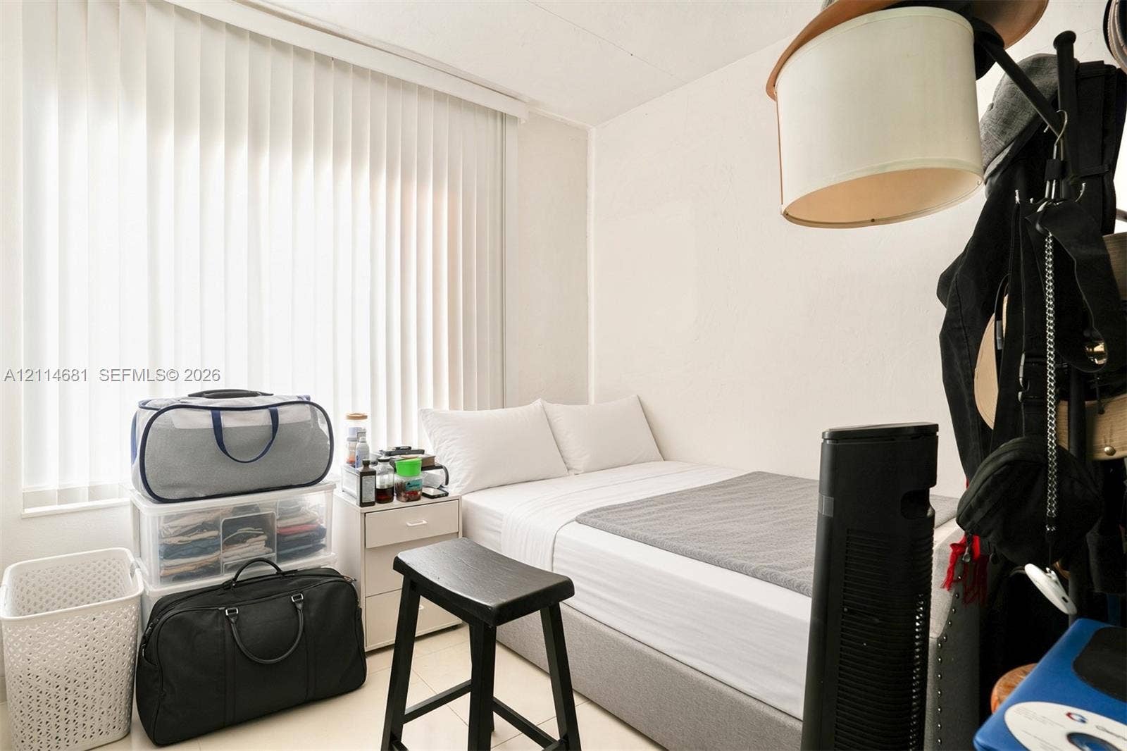 6700 NW 5th Avenue, Miami, FL 33150 Room featuring white walls, neutral-toned tile flooring, and vertical window blinds