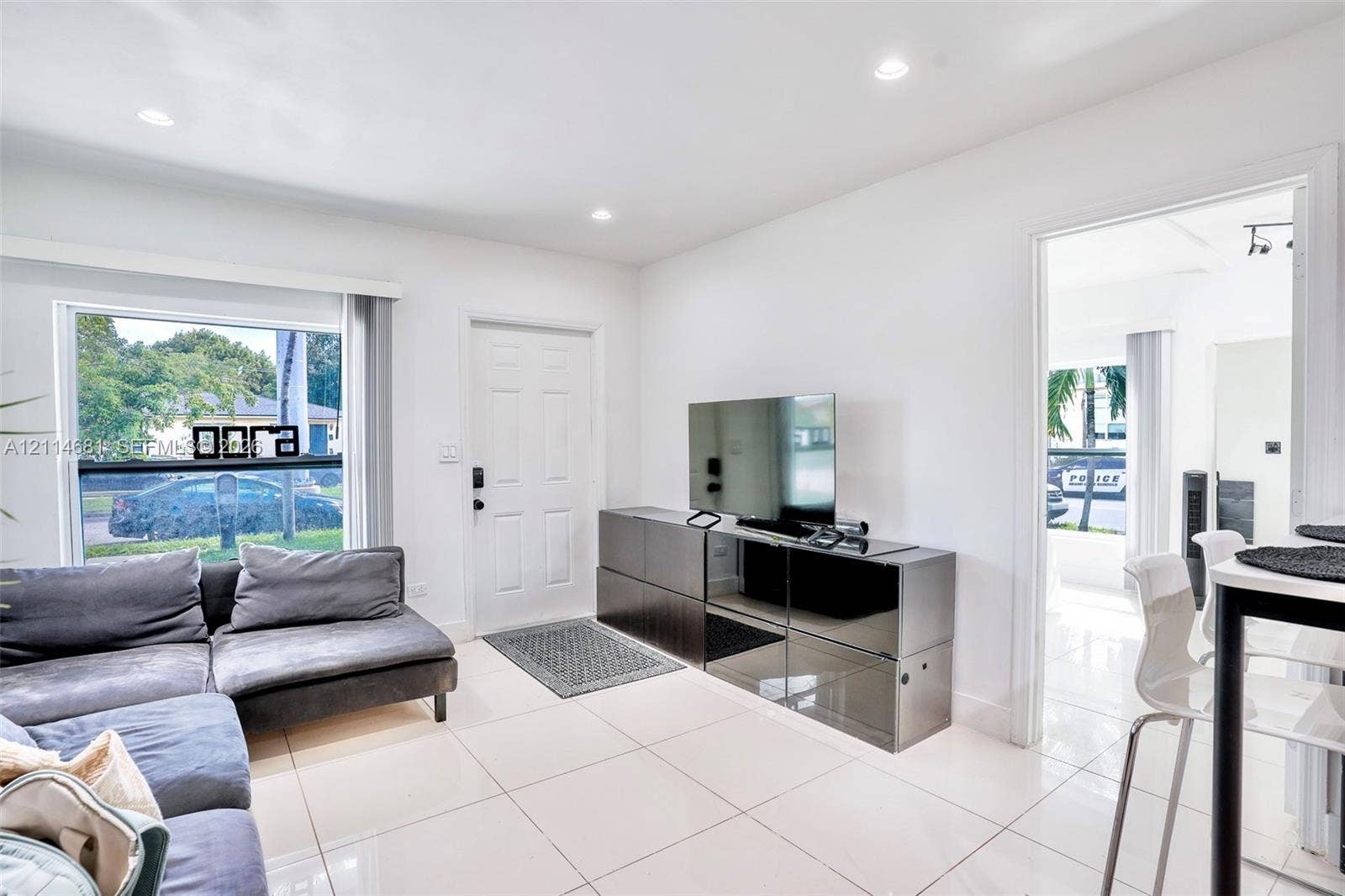 6700 NW 5th Avenue, Miami, FL 33150 Neutral-toned tile flooring, recessed ceiling lighting, and large window with natural light