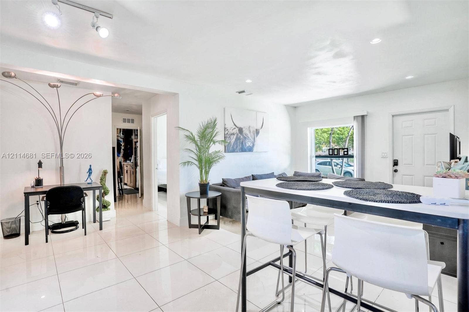 6700 NW 5th Avenue, Miami, FL 33150 Open-concept interior featuring oversized tile flooring, recessed lighting, and multi-directional track lighting
