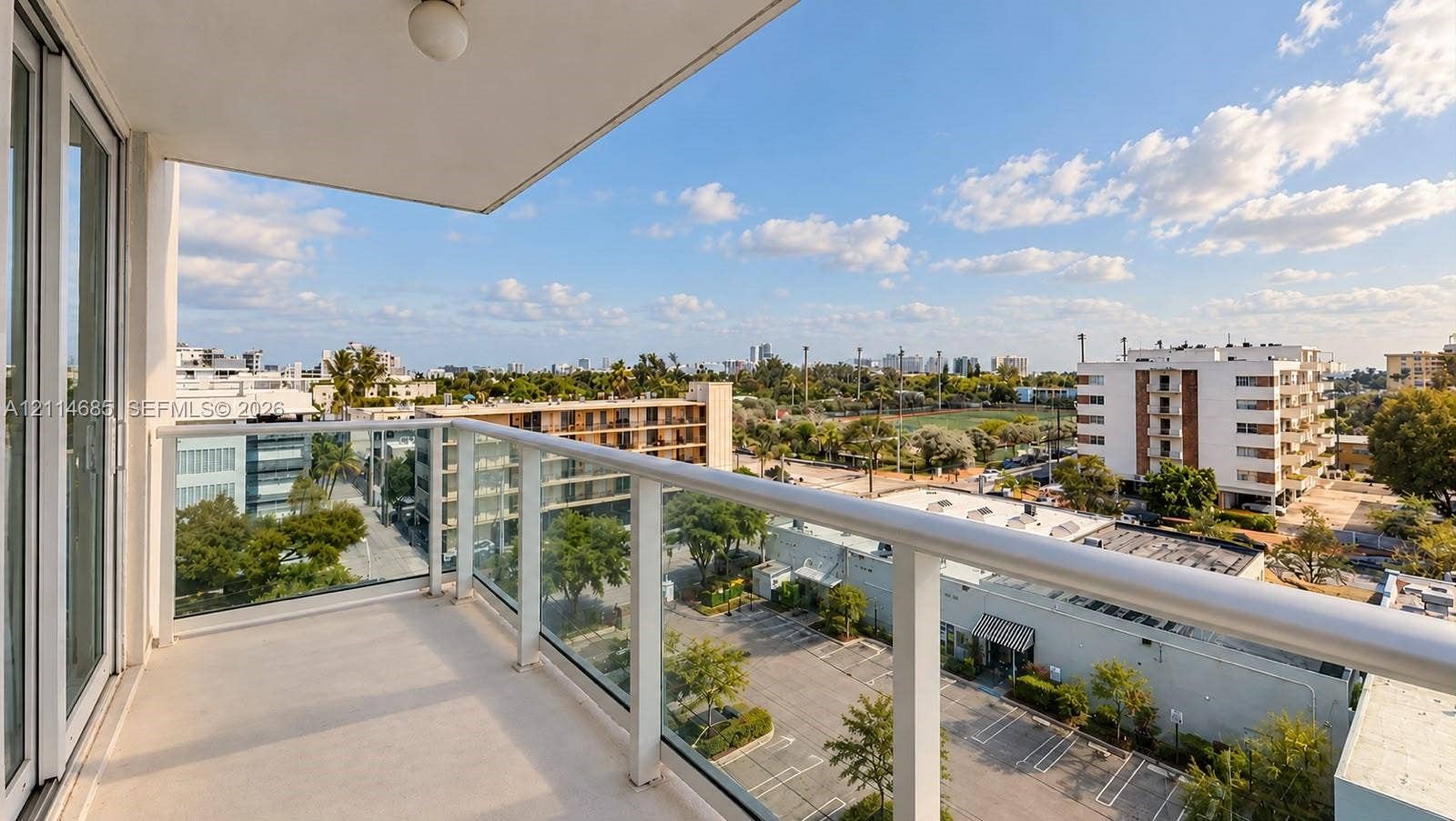 1035 West Avenue, #704, Miami Beach, FL 33139 Private balcony featuring a glass panel railing and solid surface flooring